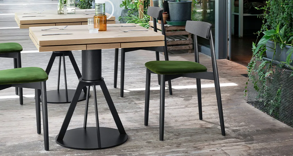 Geronimo table is a contemporary minimalist dining table with oak and walnut finishes suitable for hospitality and contract spaces