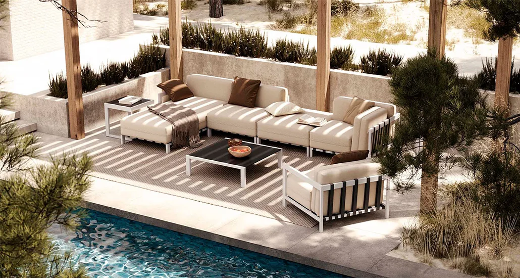 Bondi Collection is a contemporary outdoor collection with sofa and chaise lounge and is made of steel frame and fabric upholstery and is placed in a hospitality contract outdoor space.
