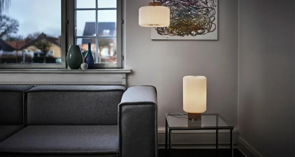 Cylinder table lamp is a contemporary LED table lamp with plastic lampshade and oak base is suitable for contract and hospitality projects