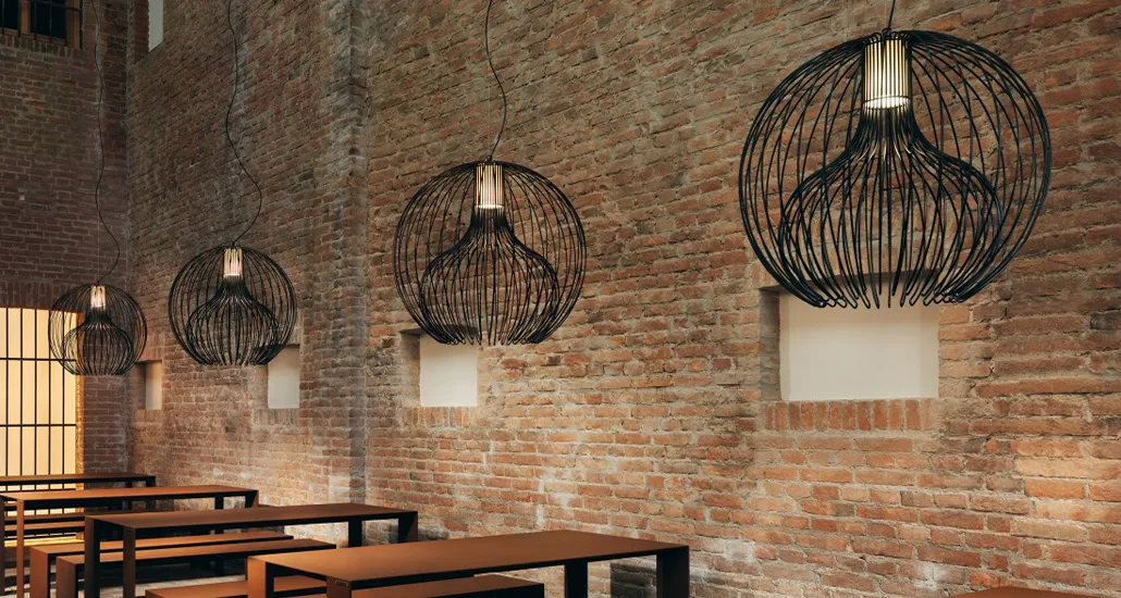 icaro ball pendant lamp by modo luce is a contemporary pendant lamp made of steel frame best suited for industrial, hospitality and contract settings