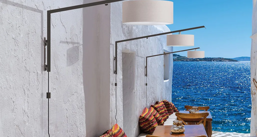 Angelica outdoor wall lamp is a contemporary metal outdoor wall lamp with fabric lampshade and is suitable for hospitality and contract projects or spaces