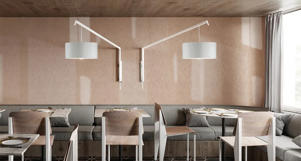 Angelica wall lamp is a contemporary wall lamp with metal structure and fabric lampshade and is suitable for hospitality, residential and contract projects
