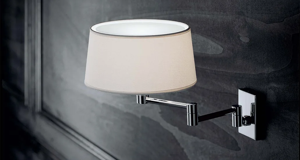 classic wall lamp is a contemporary wall lamp with fabric lampshade and brass holder and is suitable for hospitalitym contract and residential projects