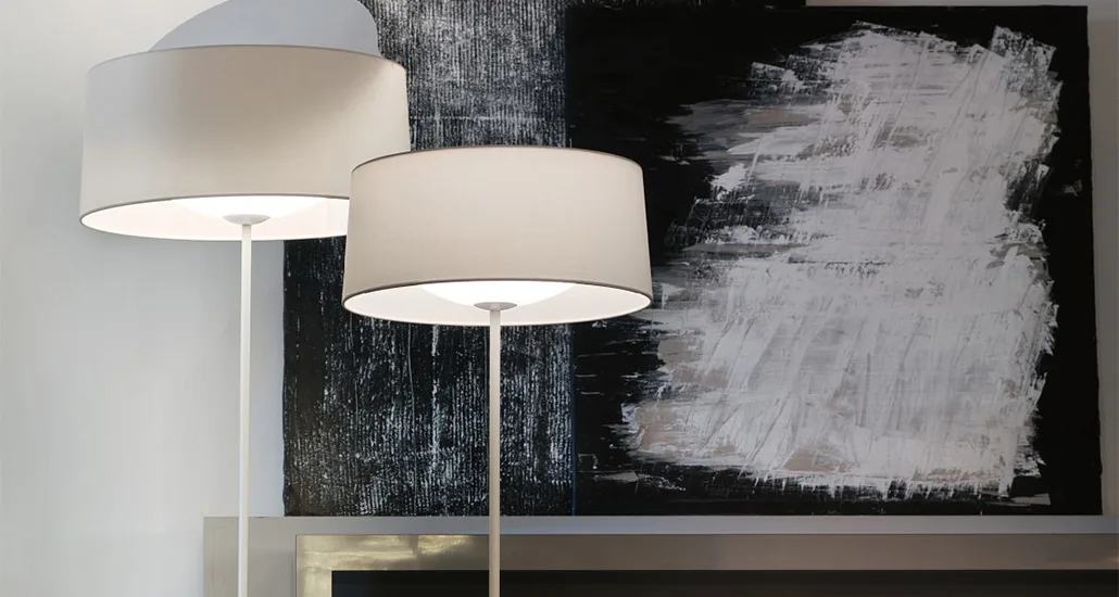 Disk Floor Lamp is a contemporary floor lamp with fabric lampshade and metal base and is suitable for hospitality, contract and residential projects