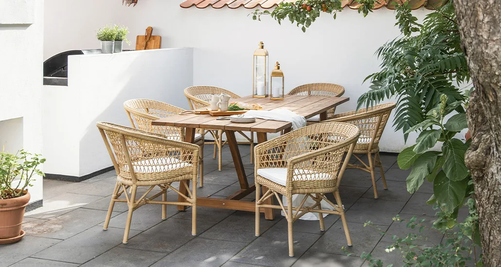 Emma exterior chair is a contemporary outdoor dining chair made of wicker suitable for hospitality exterior seating
