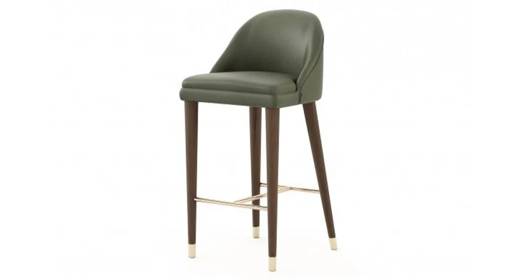 Estoril barstool is a contemporary upholstered barstool with metal caps suitable for hospitality and residential projects