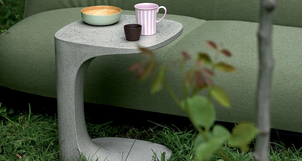 Font side table is a contemporary side table with cement or Polyethylene finishes and is suitable for outdoor settings in hospitality and contract projects