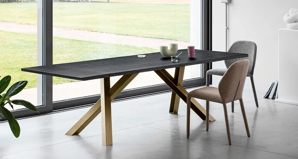 gustave dining table is a contemporary dining table with ceramic top and wood base suitable for hospitality and contract settings