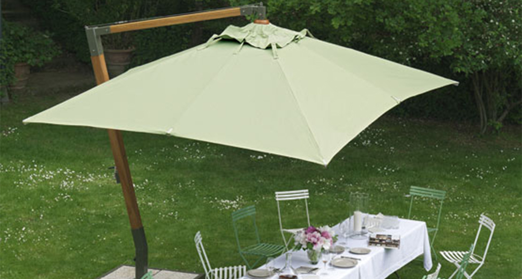 Holiday parasol is a contemporary outdoor parasol with wood stand suitable for hopitality and contract requirements