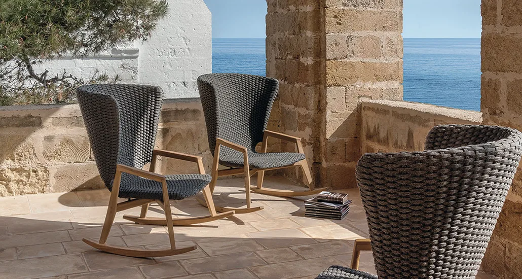 Knit Rocking Chair is a contemporary outdoor chair with rope seat and teak armrest and base. The Knit Rocking Armchair is best suitable for contract and hospitality projects.