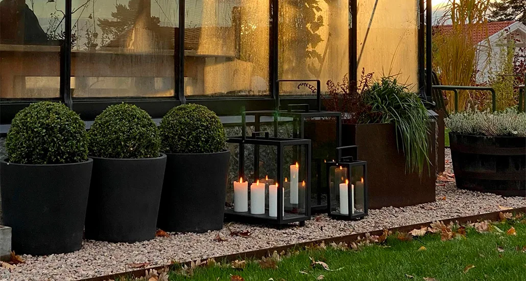 lighthouse lantern is a contemporary outdoor lantern with candle as light source and frame in aluminium or teak. lightouse is suitable for hospitality and contract projects.