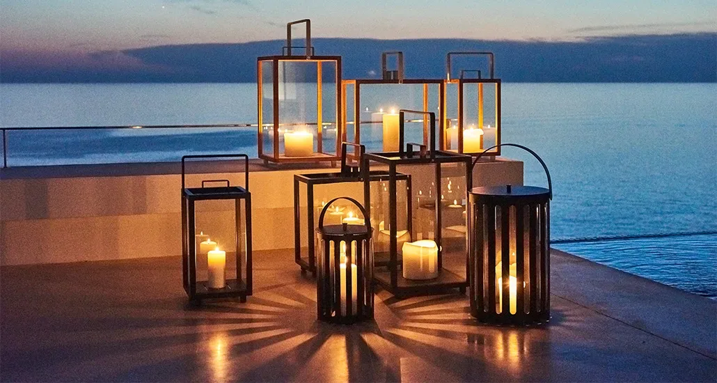 lighthouse lantern is a contemporary outdoor lantern with candle as light source and frame in aluminium or teak. lightouse is suitable for hospitality and contract projects.