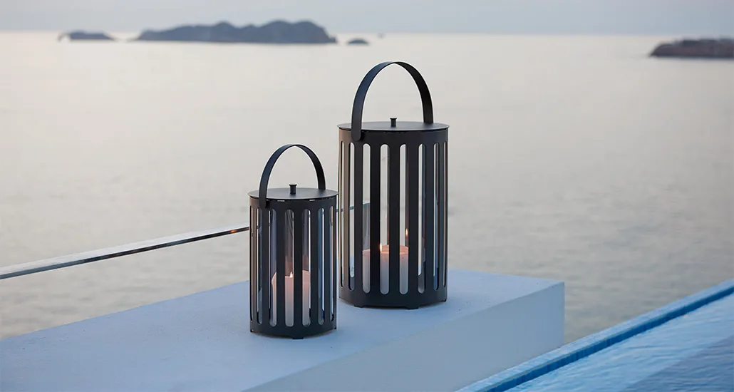 lighttube lantern is a contemporary outdoor lantern with aluminium frame and is suitable for residential, contract and hospitality projects. lighttube is cylindrical in shape and candles are used as the light source and are placed inside the metal frame with vertical opening to let light pass.