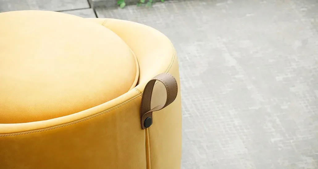 A closeup shot of the Liz pouf in bright yellow