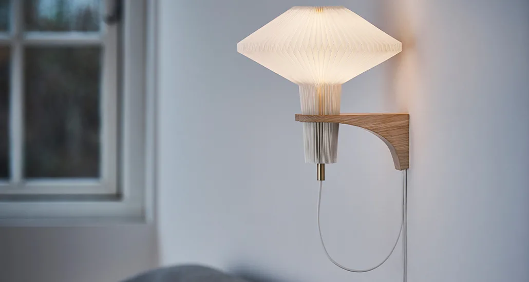 Mushroom Wall Lamp is a contemporary wall lamp with plastic lampshade and oak structure and is best suitable for hospitality, contract and residential projects