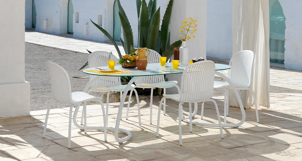 Ninfea Dinner Dining Chair is a contemporary outdoor dining chair made of fibreglass resin suitable for hospitality and contract spaces