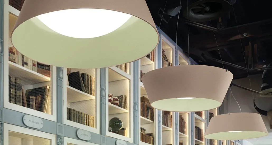 a closeup of the reverse pendant lamp by modo luce in a lighter shade. these lamps can be used in residential or hospitality spaces and they come in a variety of combinations