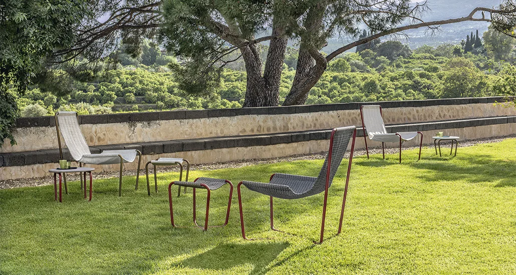 sling armchair is a contemporary outdoor chair with steel structure and fabric seat and is suitable for residential, contract and hospitality projects