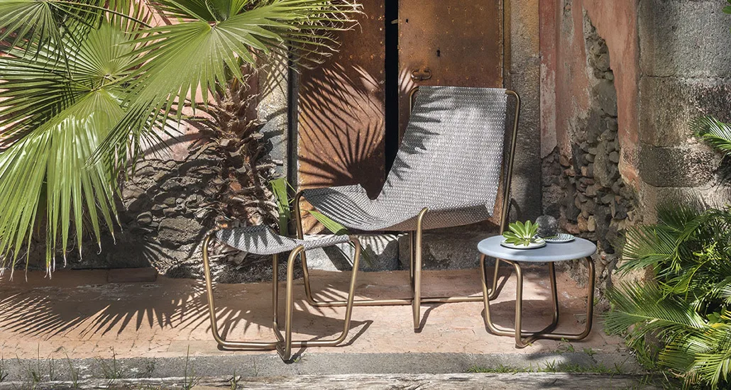 sling armchair is a contemporary outdoor chair with steel structure and fabric seat and is suitable for residential, contract and hospitality projectss
