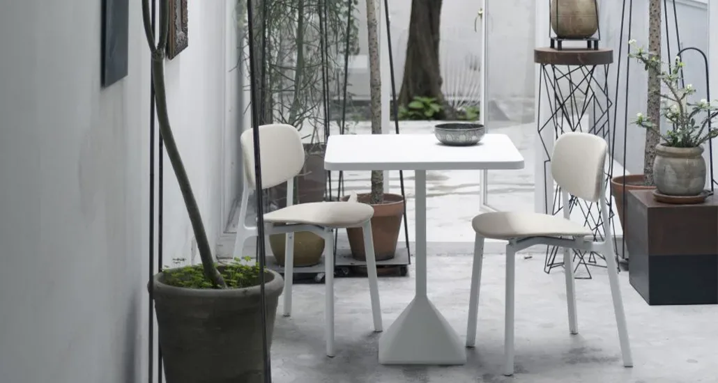 TNP table in white around the the square dining table, the TNP table can be used in hospitality settings