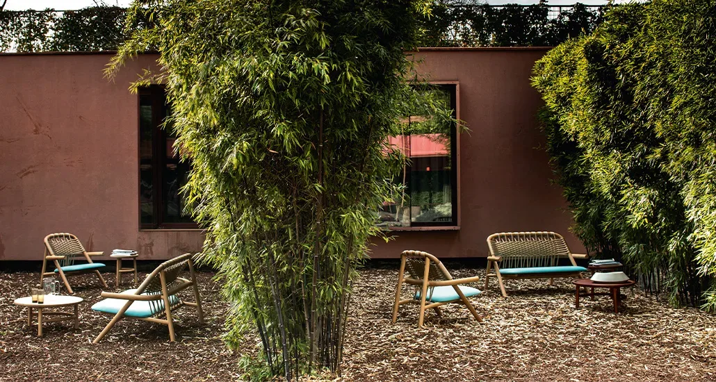 unam lounge chair and lounge settee outside in a garden