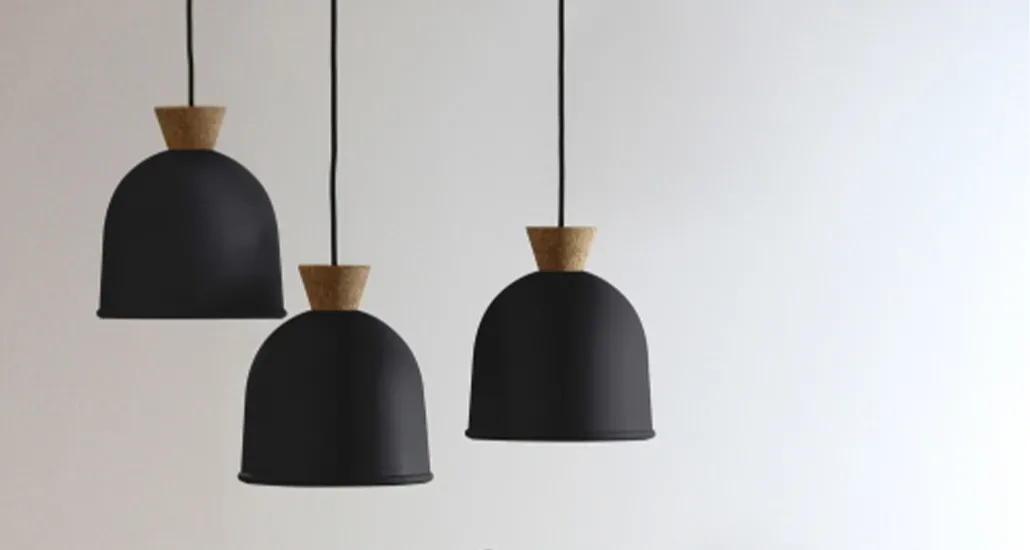 a closer look at three vedra pendant lights, all in matte black. these lights can be used in hospitality and residential spaces