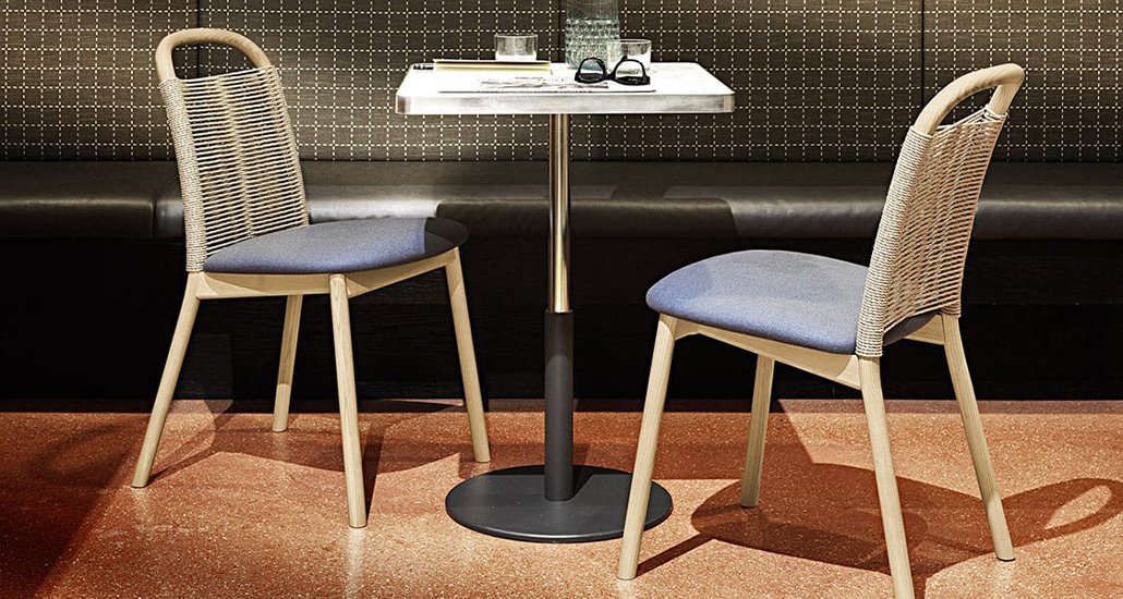 Zantilam 32 NR Chairs placed in an restaurant with booth seating in background and marble table top cafe table