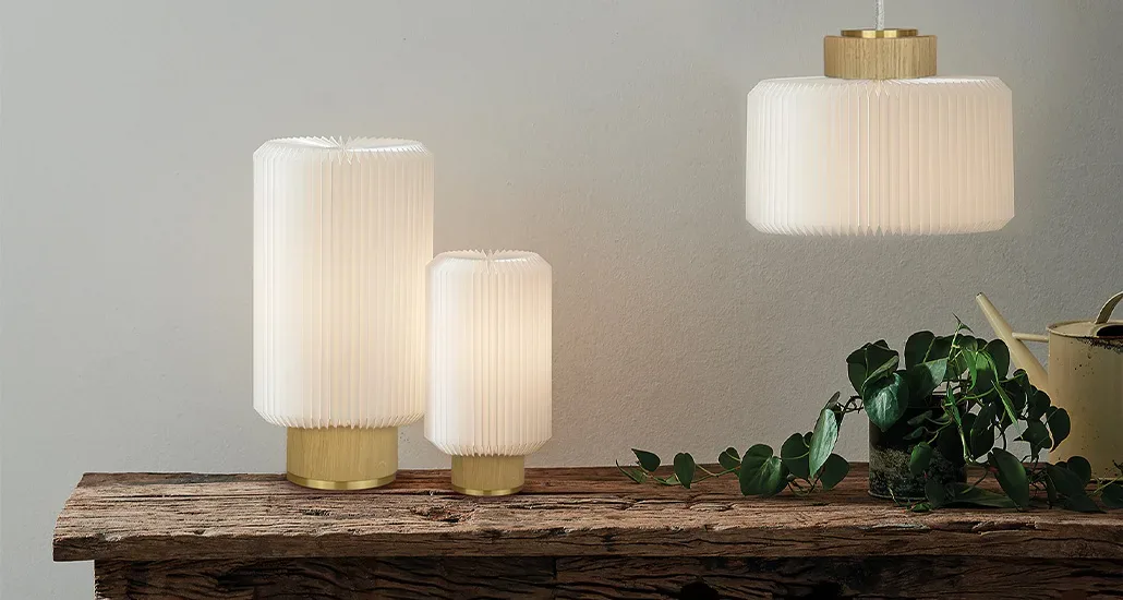 Cylinder table lamp is a contemporary LED table lamp with plastic lampshade and oak base is suitable for contract and hospitality projects