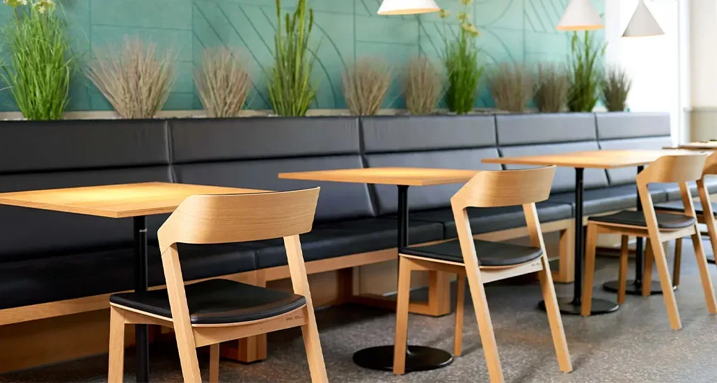 Merano chair is a contemporary upholstered dining chair with wood structure and is suitable for contract and hospitality projects