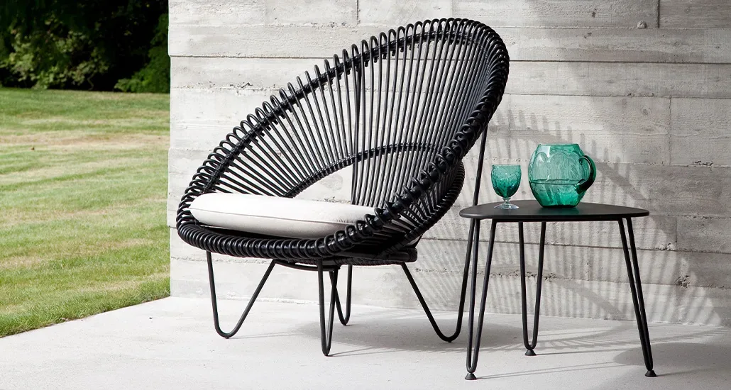 roy cocoon lounge chair is a contemporary outdoor lounge chair with wicker and aluminium frame and suitable for hospitality and contract projects.