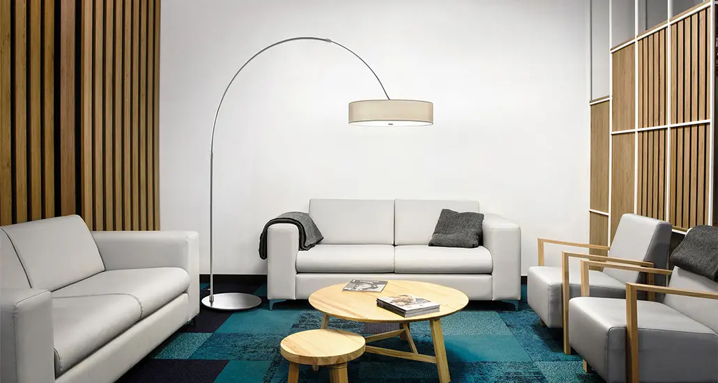 iris floor lamp a contemporary LED floor lamp with metal structure fabric lampshade is placed in contract hospitality space.