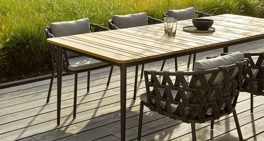 leo dining table is a contemporary outdoor dining table with teak top and aluminium base and is suitable for contract and hospitality spaces.
