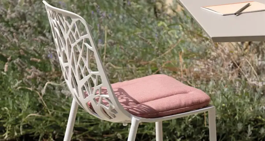 Forest Chair is a contemporary outdoor dining chair with aluminium frame and is placed in hospitality contract outdoor space.