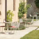 Forest Chair is a contemporary outdoor dining chair with aluminium frame and is placed in hospitality contract outdoor space.
