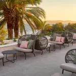 Kodo Cocoon by Vincent Sheppard is a contemporary outdoor lounge chair and aluminium frame and rope and is placed in the contract hospitality spaces.