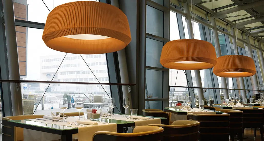 loto pendant lamp is a contemporary pendant lamp with glass and fabric structure and is suitable for hospitality and contract spaces.