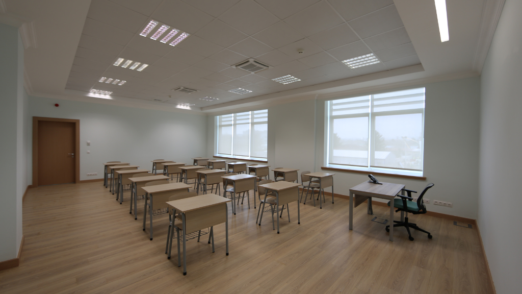 classroom space with chairs, desks for students and task chair