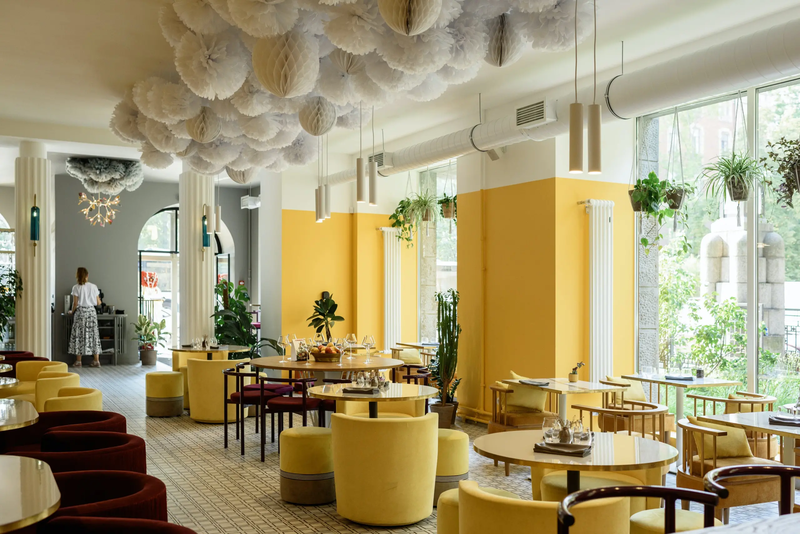 restaurant contract furniture with yellow lounge seating and yellow and white walls.